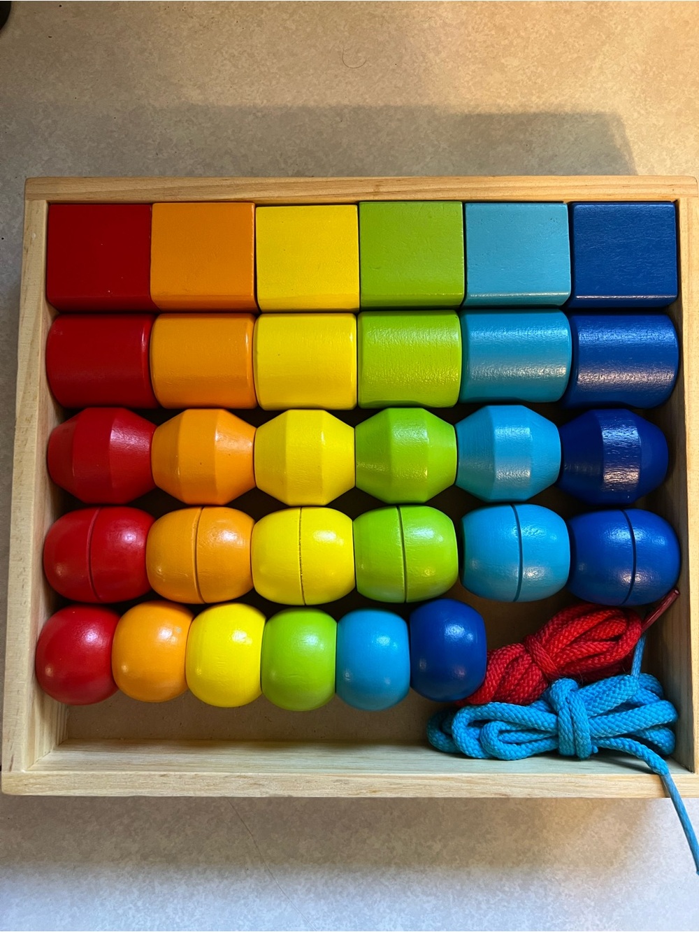 Melissa & Doug Rainbow Wooden Lacing Beads in Red, Orange, Yellow, Green, Blue